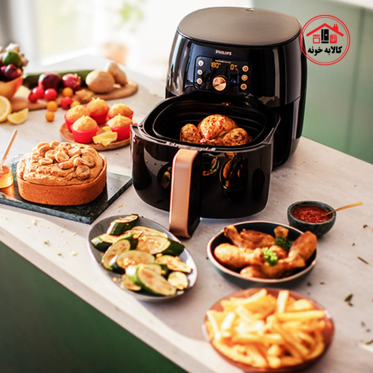 سرخ کن بدون روغن فیلیپس مدل 9867/90 که روی کانتر آشپرخانه است و بسکت آن جدا شده.