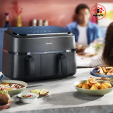 سرخ کن فیلیپس na350 که روی اپن آشپزخانه است و کنار آن ظرف غذا است